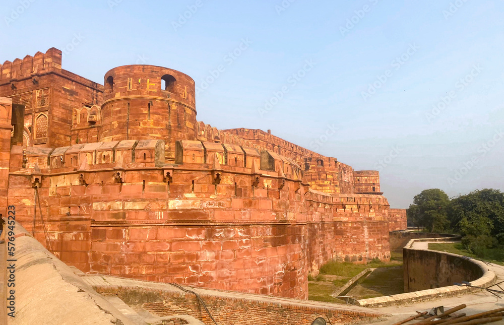 The famous red fort in the city of Agra, India. Tourists visit a popular tourist attraction.