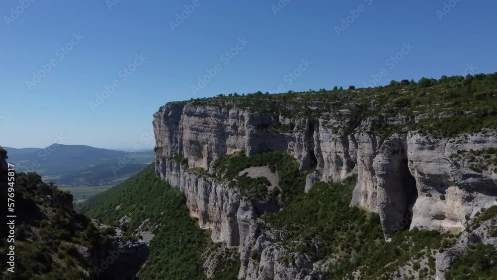 Aerial image of a large rocky canyon. Stone walls, vertical rocks, feeling of vertigo. Relaxing natural landscape, pure nature. Intense green tones. Aerial image of a large rocky canyon. Stone walls, vertical rocks, feeling of vertigo. Relaxing natural landscape, pure nature. Intense green tones.