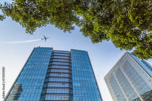 plane flying over the skyscrapers