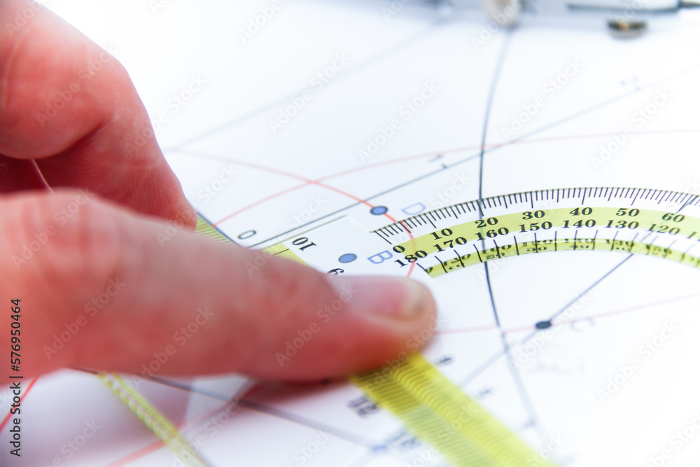 Professional architect working at his desk, measuring and estimating the building project Professional architect working at his desk, measuring and estimating the building project
