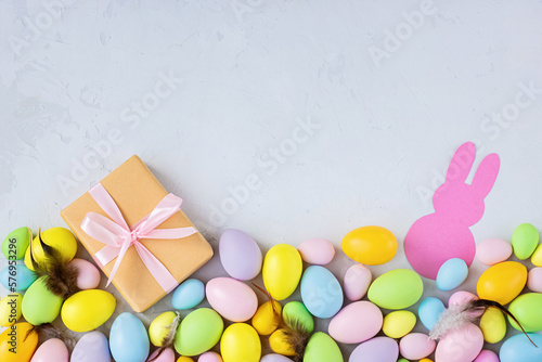 Wall Mural Stylish background with colorful easter eggs on gray concrete background