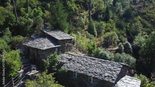 Drone flyover suspended Foz d´égua bridge towards schist Houses in historic village. Portugal photo