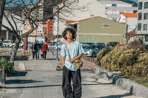 urban teenager walking down the street