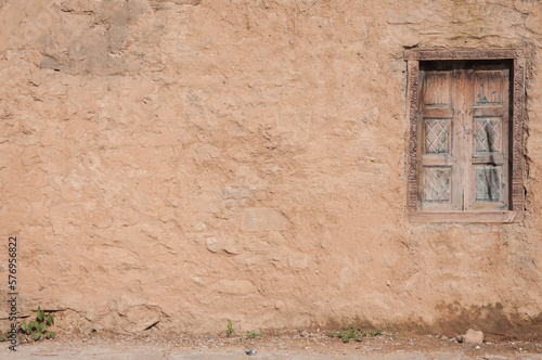 Mud wall with a window on the side Saidpur Village Islamabad Pakistan