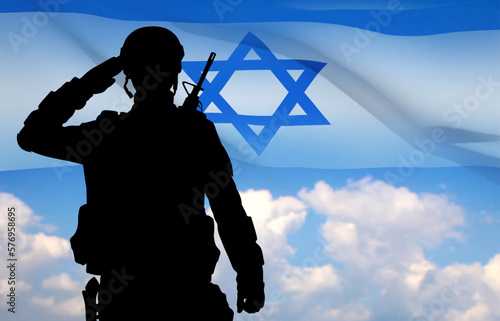 Silhouette of a saluting soldier with Israel flag against the sunrise. Armed forces of Israel. EPS10 vector