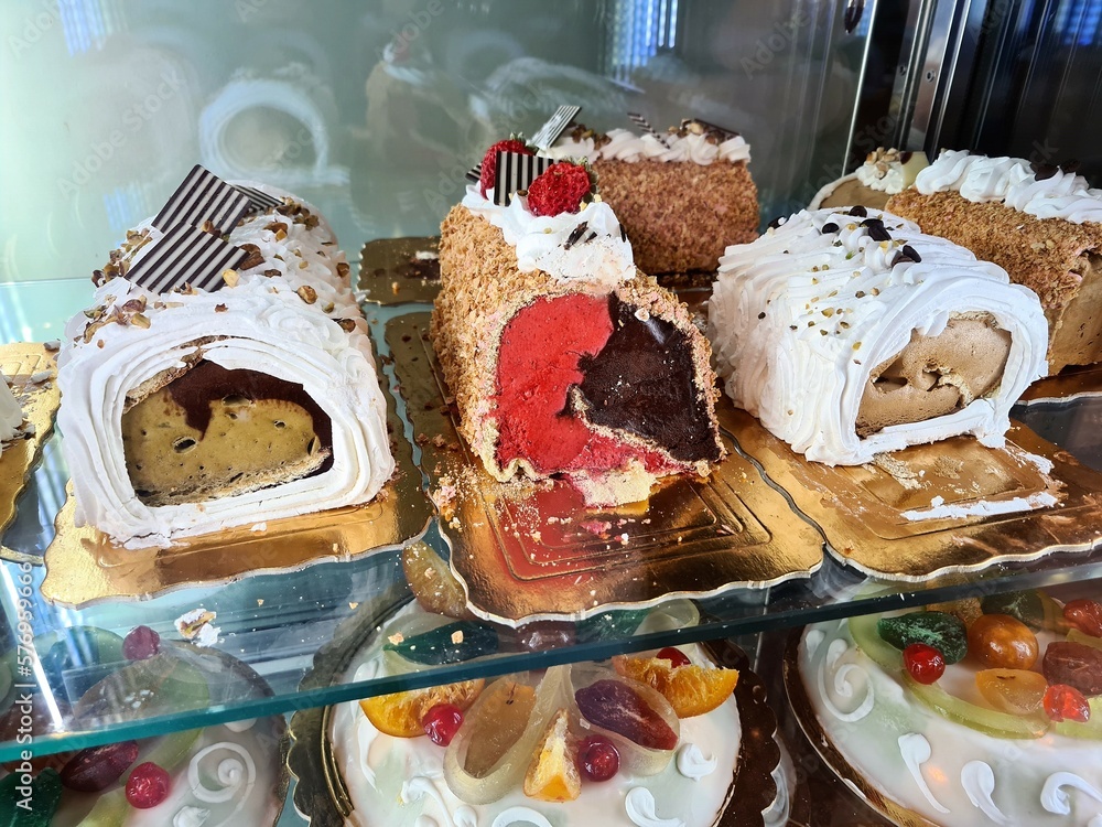 evocative image of typical Sicilian pastry cakes and ice creams in an ice cream shop window