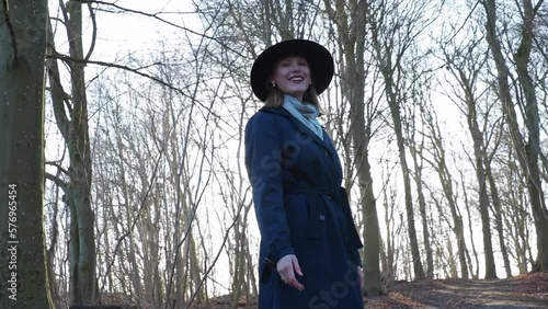 happy young woman in a forest in denmark
