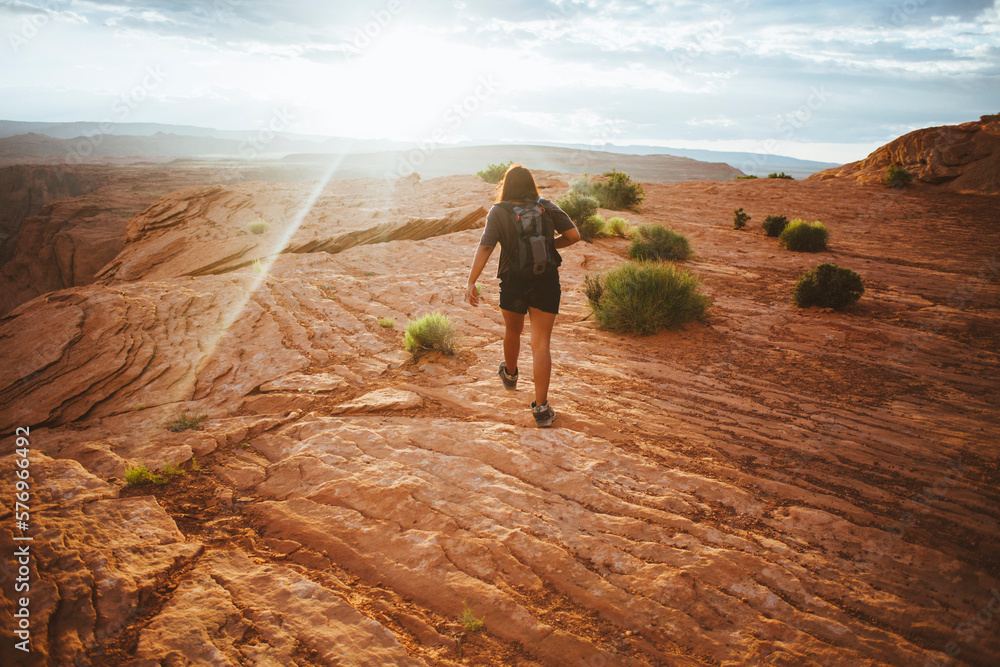 A woman hiking to Horseshoe Bend in Arizona A woman hiking to Horseshoe Bend in Arizona