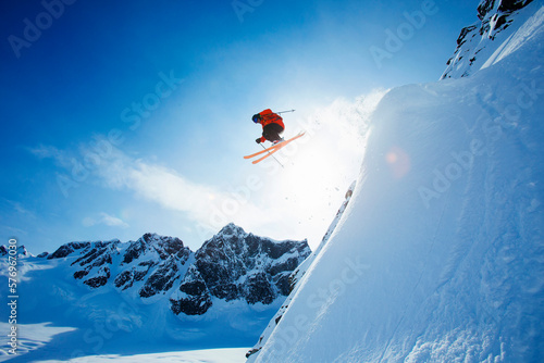 Extreme skier in mid-air after jump, Neacola Mountains, Alaska, USA