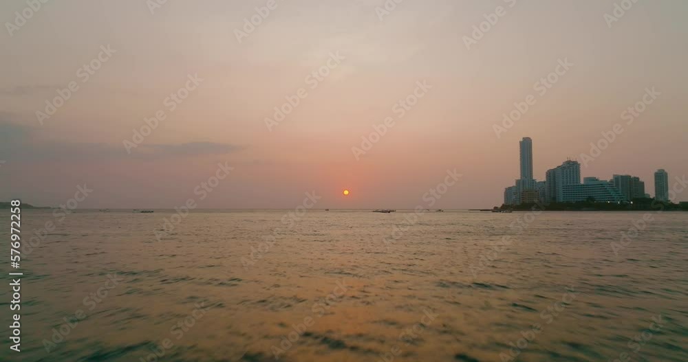Aerial Drone shot of the sunset movieng fast the city in the back in Cartagena, Colombia Aerial Drone shot of the sunset movieng fast the city in the back in Cartagena, Colombia