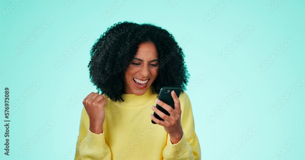 Yes, winning and phone of black woman isolated on a green background fist pump, celebration or competition winner. Excited, wow person on smartphone, cellphone or mobile app bonus, sale or good news Yes, winning and phone of black woman isolated on a green background fist pump, celebration or competition winner. Excited, wow person on smartphone, cellphone or mobile app bonus, sale or good news