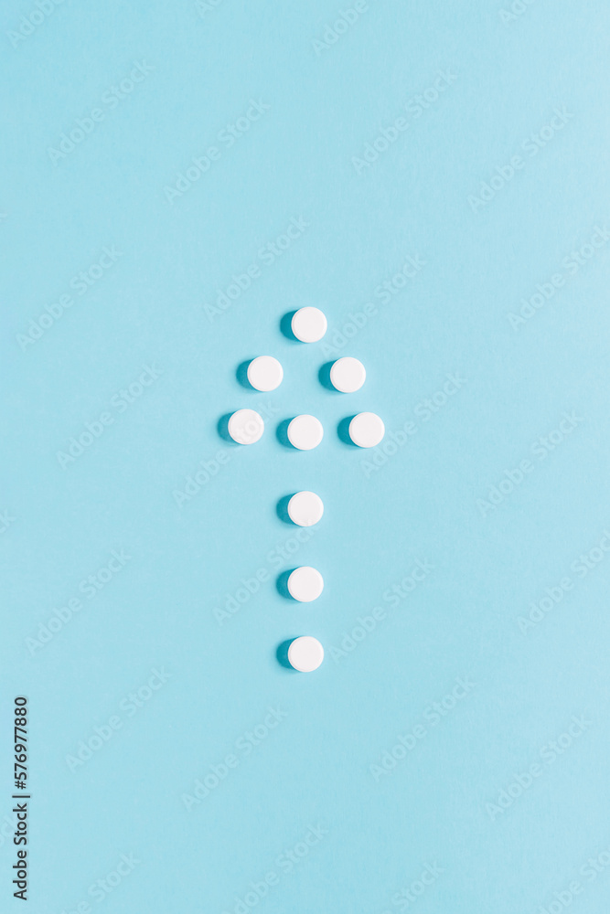 Scattered white pills on blue background. Mock up for special offers as advertising, web background or other ideas. Medical, pharmacy and healthcare concept. copyspace. Empty place for text or logo Scattered white pills on blue background. Mock up for special offers as advertising, web background or other ideas. Medical, pharmacy and healthcare concept. copyspace. Empty place for text or logo