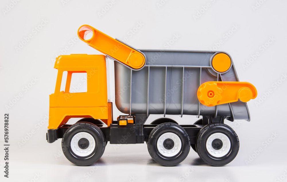 Career truck. Multi-colored children's toys plastic trucks on a white background.