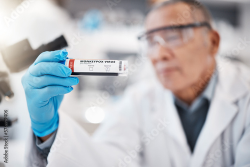 Test tube, science and scientist in laboratory for monkeypox for research, medical study and vaccine. Healthcare, pharmaceutical and hand with vial for lab test, virus sample and disease breakthrough