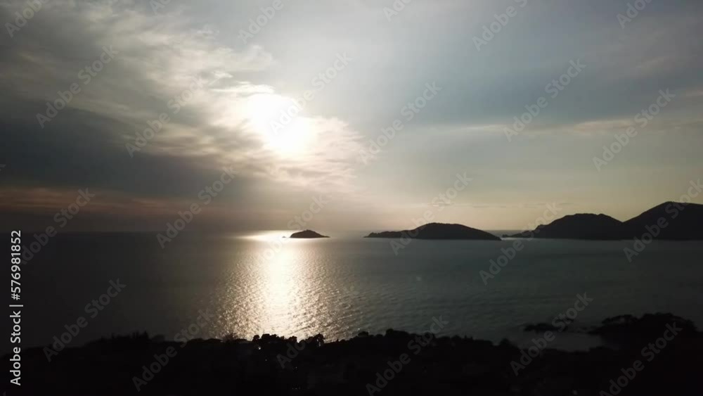 Sun through the clouds over islands in the Mediterranean Sea Sun through the clouds over islands in the Mediterranean Sea