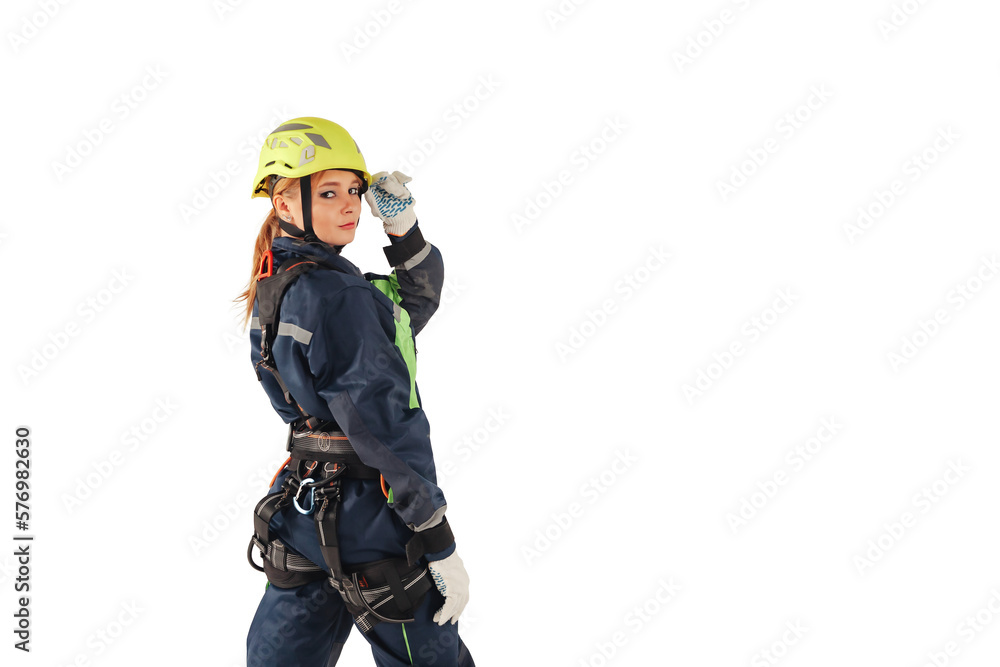 Industrial woman in industry uniform and protective helmet posing welcomes at isolated white empty background, looking at camera. Lady worker in workwear turned around in isolation. Copy ad text space
