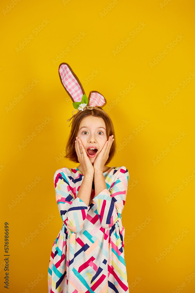 Happy playful teenager girl wearing bunny ears Happy playful teenager girl wearing bunny ears