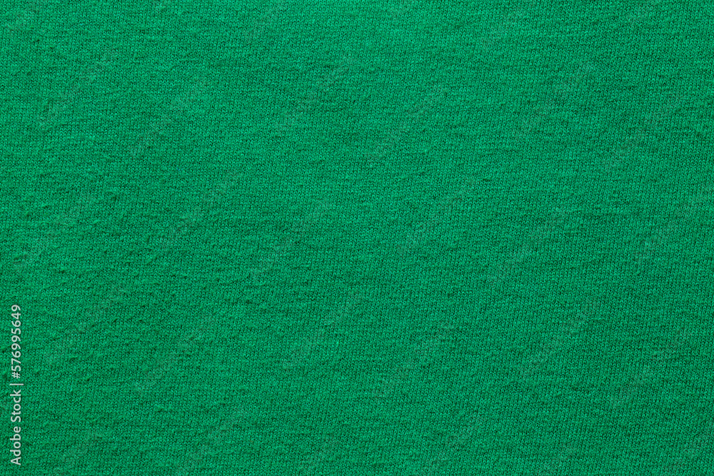The Dark green velvet texture background. Green velvet fabric The Dark green velvet texture background. Green velvet fabric