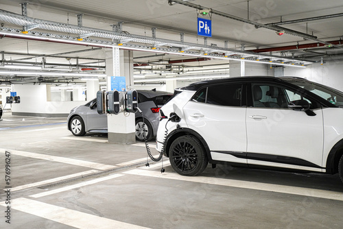 Charging electric station for charging cars in the underground parking. The concept of ecological energy systems.