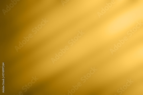 Abstract gold color background texture with some smooth lines and highlights in it for copyspace.