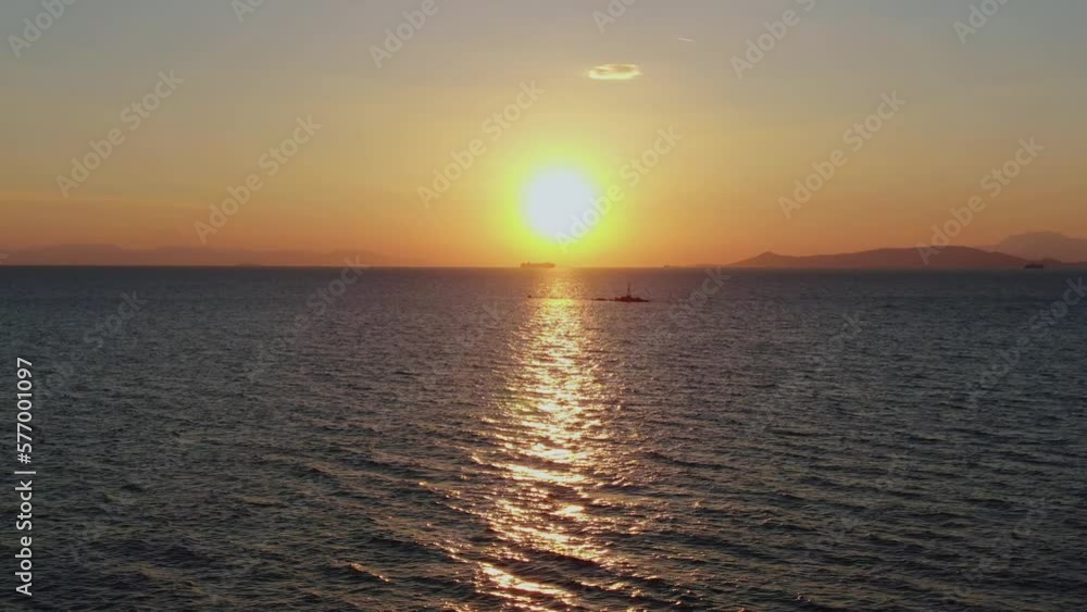 Golden sunset over the sea in Athens, Greece Golden sunset over the sea in Athens, Greece