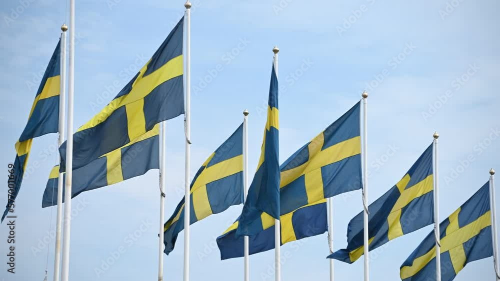 Flag of Sweden waving in the wind on a sunny day.