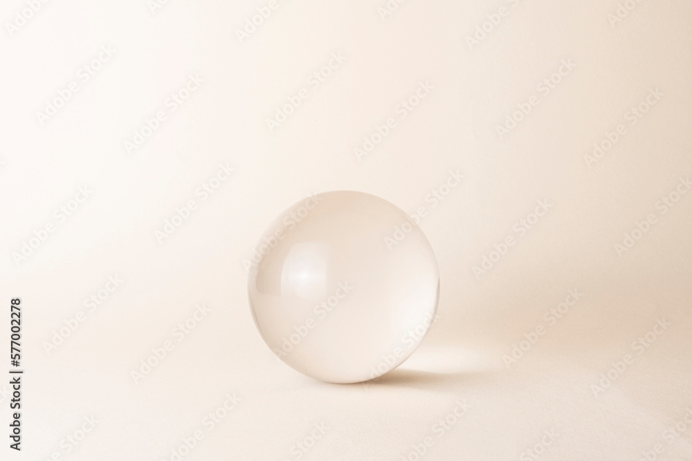 glass sphere on beige background - obrazy, fototapety, plakaty 