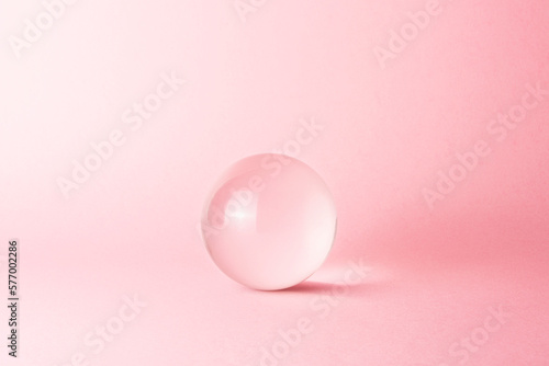 glass sphere on pink background