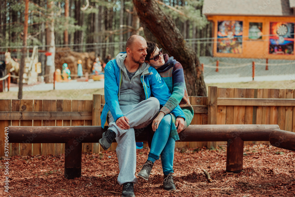 A romantic couple spending time in the park. A couple taking photo on a beautiful sunny day while having a weekend off A romantic couple spending time in the park. A couple taking photo on a beautiful sunny day while having a weekend off