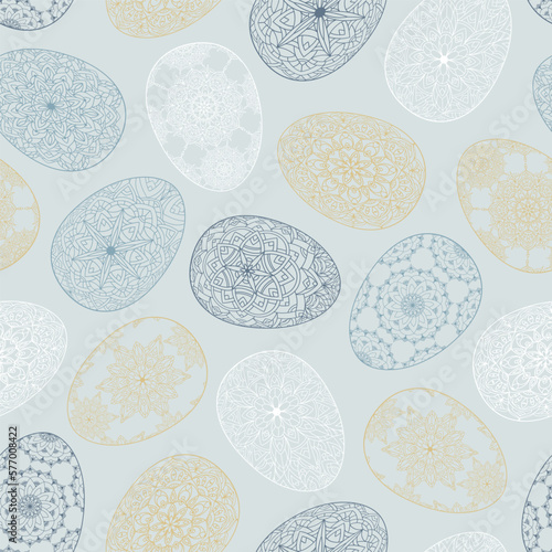 Hand drawn seamless pattern of Easter eggs with patterns, mandala, flowers, leaves on blue background. Ornate outline illustration at Easter greeting card, wallpaper, wrapping paper, textile, fabric