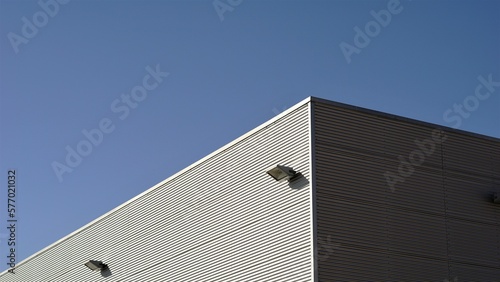 warehouse facade roof corner against the sky