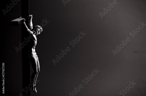crucifix with crucified christ in black and white, space for text burial