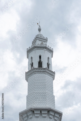 The minarets domes of the mosque against the sky in the background