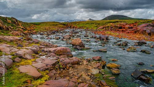 Panoramic view over a highland glacial river and surreal volcanic landscape in Iceland  summer  with dramatic sky