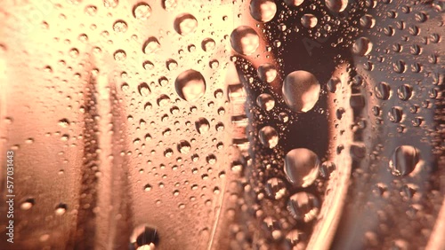 macro level view of water sweat water beads in bottle bright light