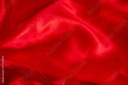 Red bed linen gradient texture blurred curve style of abstract luxury fabric,Wrinkled bed linen and dark gray shadows,background