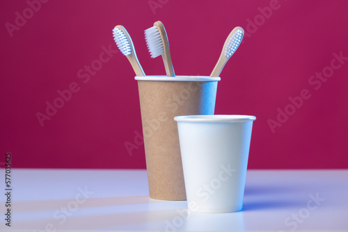 Toothbrush in a cardboard ecological cardboard cup, hygiene health care.