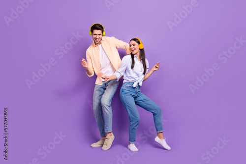 Photos Full body photo of two carefree overjoyed people chilling dance enjoy playlist i