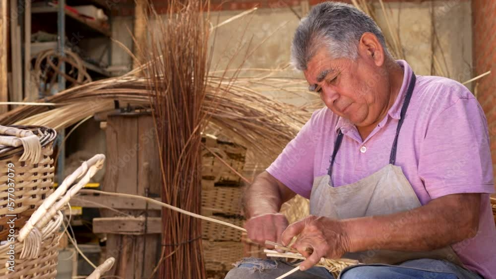 South American old man concentrated on weaving wicker basket. Slide transition video camera effect. South American old man concentrated on weaving wicker basket. Slide transition video camera effect.