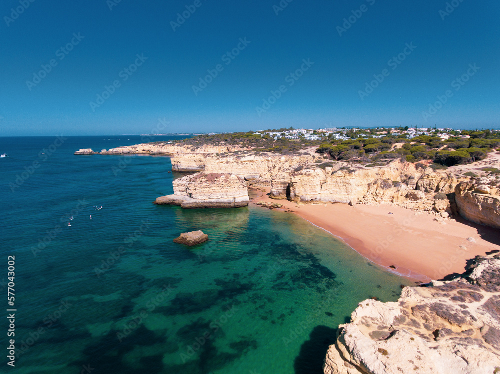 Aerial photos of Algarve Coast in Faro, Portugal capture the region's stunning beaches, rugged cliffs, and charming towns from a unique perspective, offering breathtaking views of the natural beauty