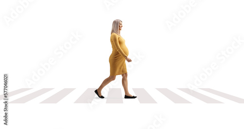 Pregnant walking on a pedestrian corssing photo