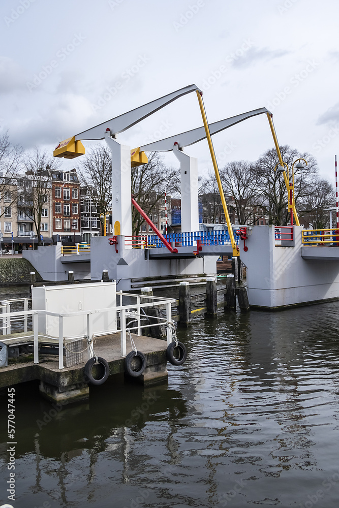 Fototapeta premium Pelican drawbridge (Pelikaanbrug) in the Kleine Wittenburgerstraat over the Nieuwe Vaart. Amsterdam, The Netherland. 