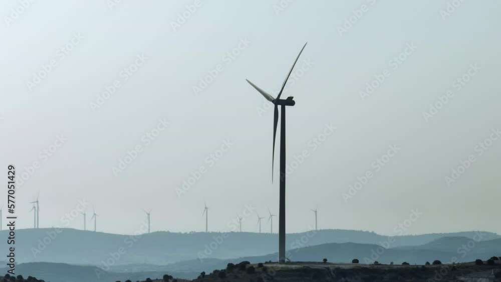 Aerial view of a wind power plant with windmills and spinning turbines. Alternative sources of electricity, green energy. High quality 4k footage Aerial view of a wind power plant with windmills and spinning turbines. Alternative sources of electricity, green energy. High quality 4k footage
