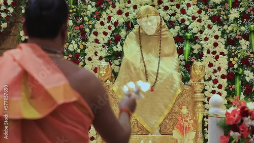 Closeup video of the Sai Ram or Sai Baba idol being worshipped with arti photo