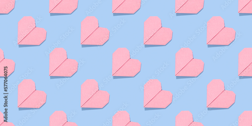 Heart pattern. Pink valentines on a blue background.