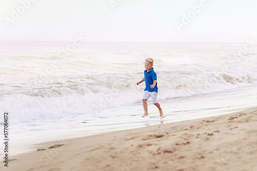 Happy kids running on the beach