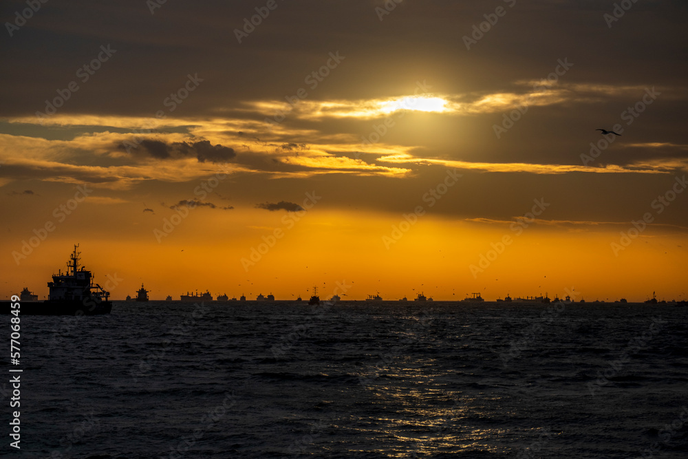Ships waiting in the Marmara Sea to pass through the İstanbul Bosphorus. cloudy sunset. backlight. Ships waiting in the Marmara Sea to pass through the İstanbul Bosphorus. cloudy sunset. backlight.