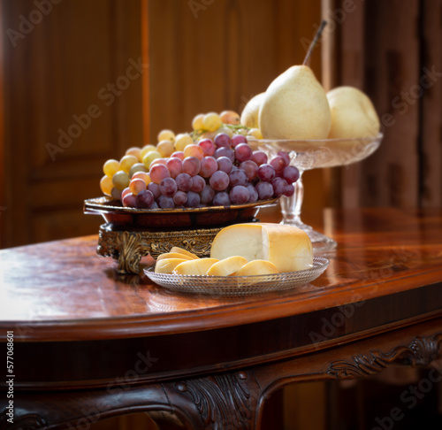 still life with full plate of ftuits wooden on background photo