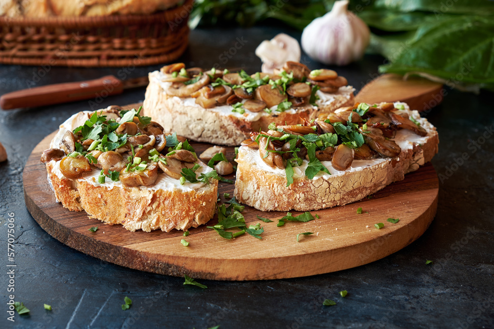 Beautiful appetizing bruschetta cream cheese and fried champignon mushrooms. Beautiful appetizing bruschetta cream cheese and fried champignon mushrooms.