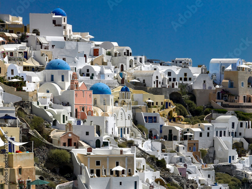 The town of Oia on the clifftop above the volcanic caldera on the Greek volcanic island of Santorini (Thira) in the southern Aegean Sea.